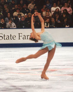 This is one of the Amy Mossman photos we used for the Ballet Secrets web site banner.  It’s the one with the skater leaning back with her leg extended behind her in a spin. 